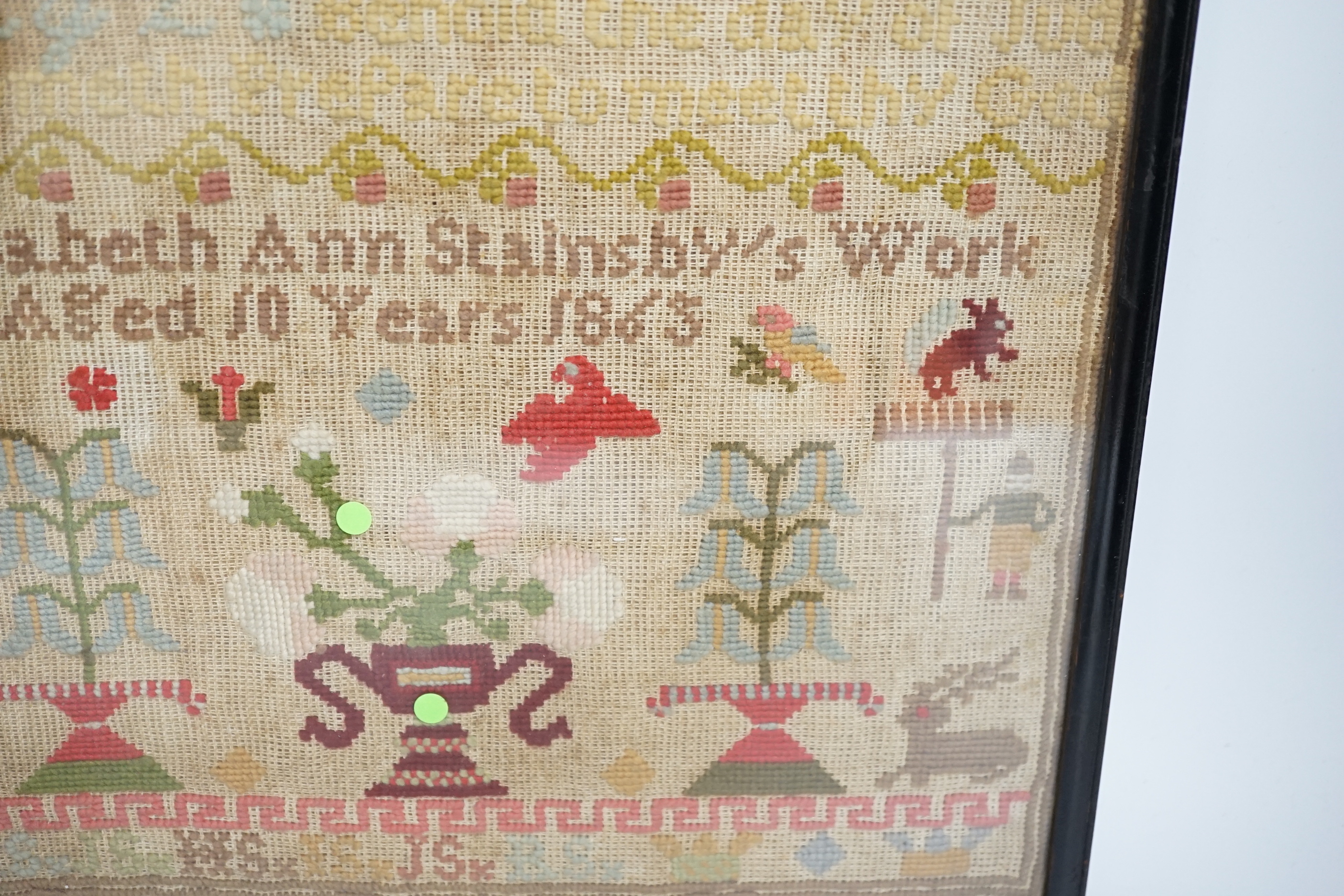 A fine cross stitch needlework sampler, by Sarah Graham, dated Oct 1842, in original frame, 36 x 30cms, and a later wool worked sampler ‘’Elizabeth Ann Stamsby’s Work Aged 10 Years 1865’’ (2)